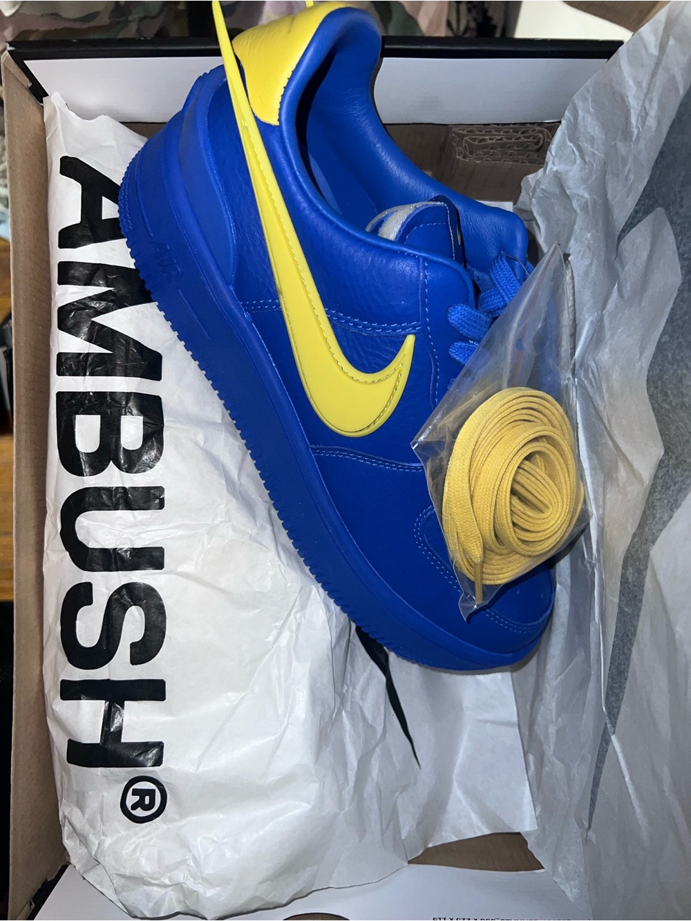Nike Blue Low-Top Sneakers with Yellow Swoosh